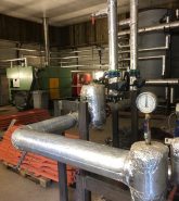 Biomass converter providing heat and hot water for ABDO College
